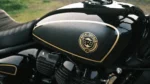 Royal Enfield The Reload 650 by RSD showcased in a cinematic studio setting with black and gold AMA-inspired race-bike styling, aggressive fairing design, premium custom detailing, and retro superbike aesthetics.